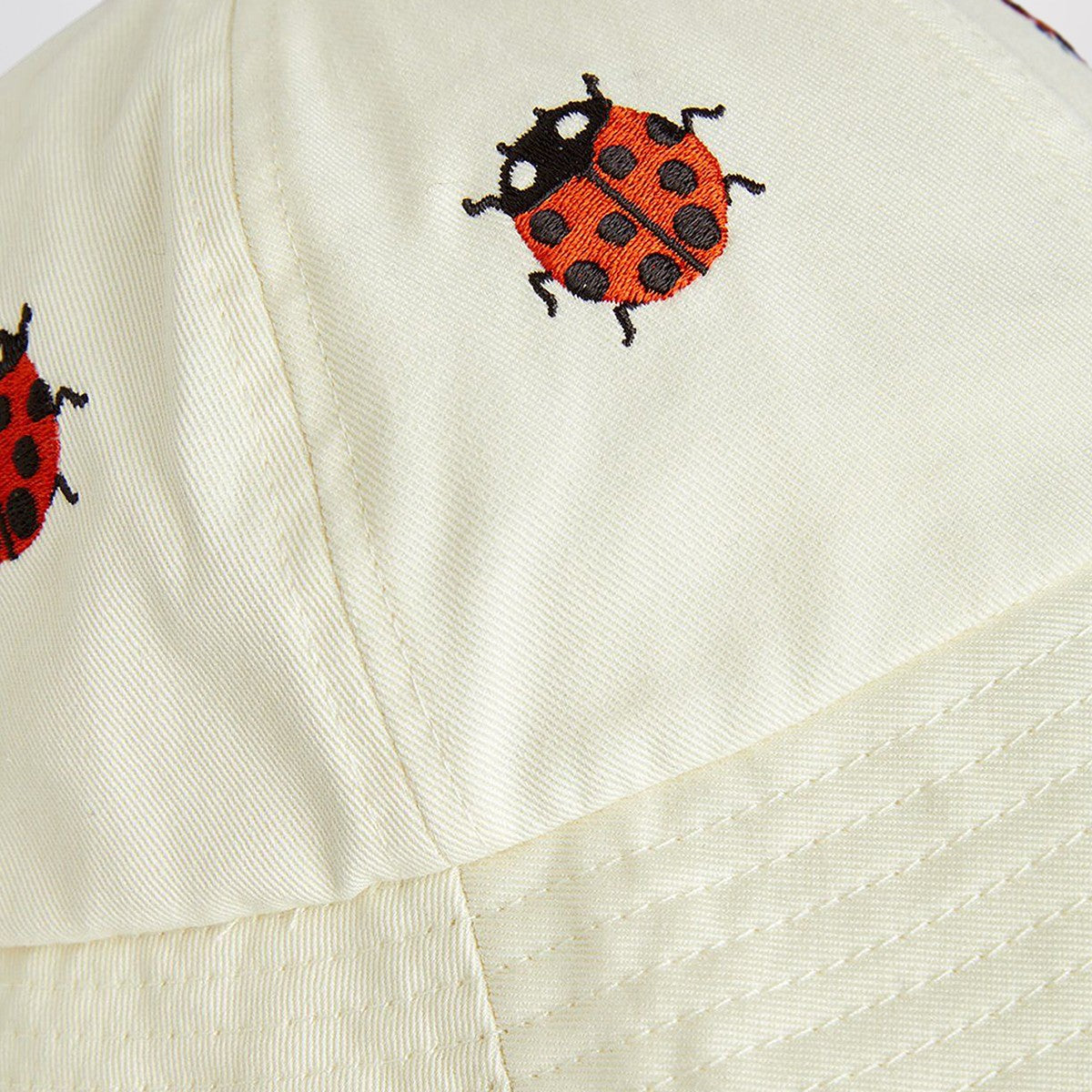 Mini Rodini White hat with ladybugs