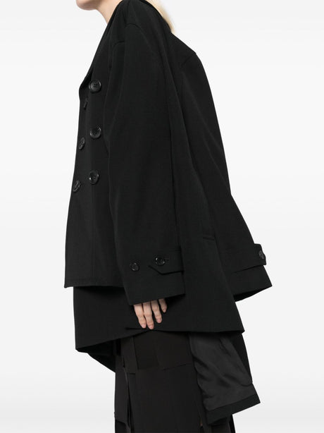 Comme Des Garcons Complete with asymmetrical sleeves