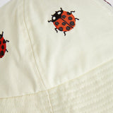 Mini Rodini White hat with ladybugs